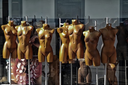 Row of store mannequins with "perfect bodies" as an advert against plastic surgery Scotland